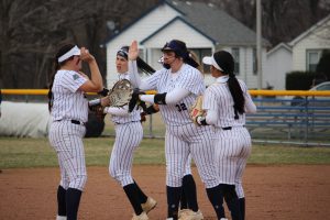 Photo of Infielders and Pitcher (32) Haley Kohnen