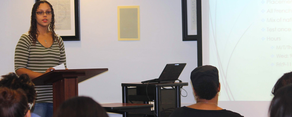 A photo of a student in the Speaking Center