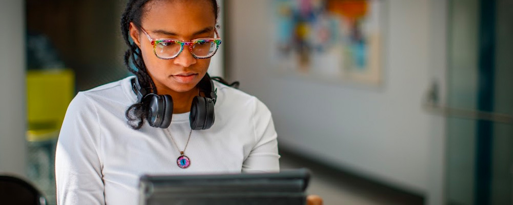 A photo of a student on her laptop computer.